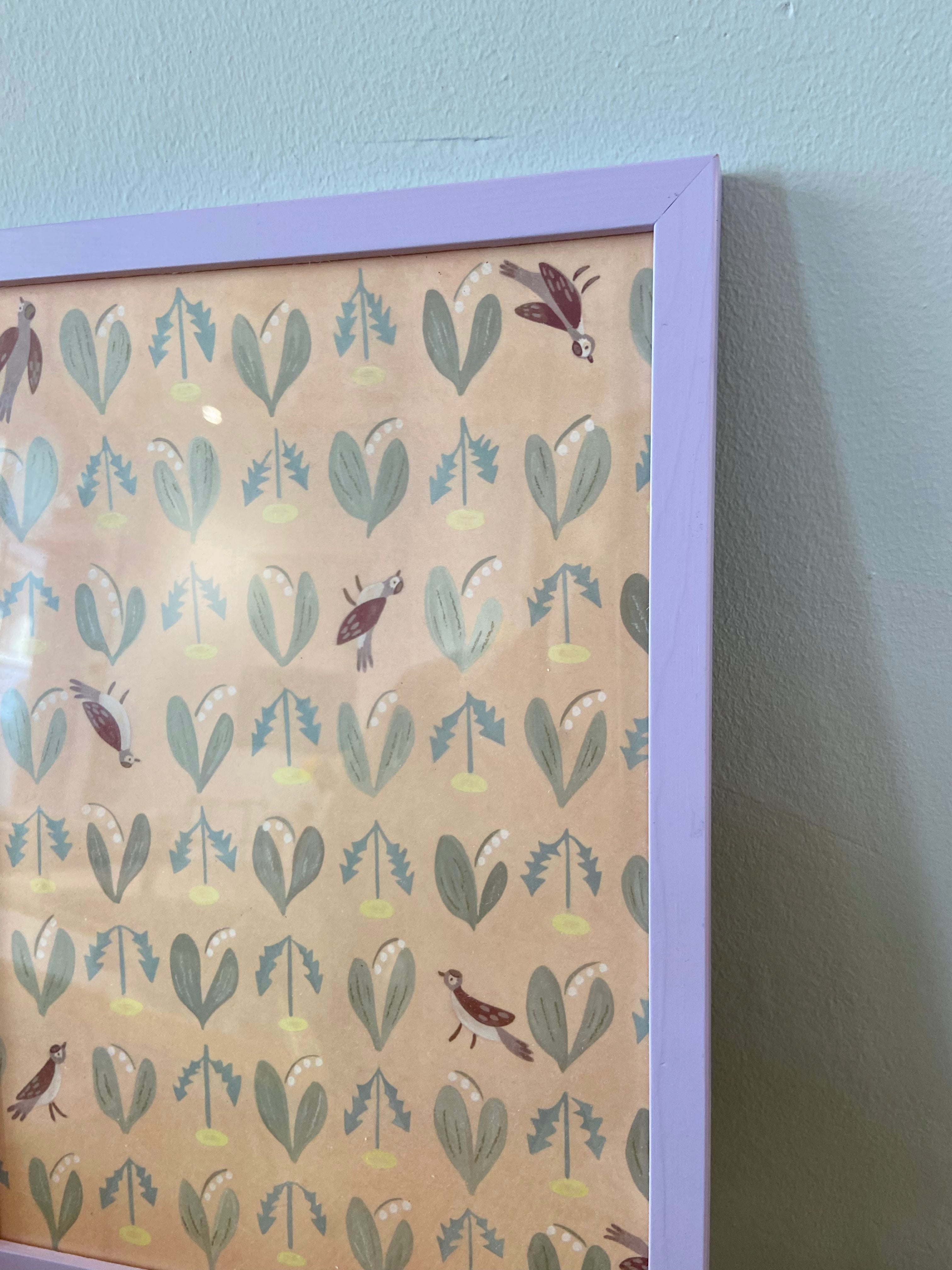 Birds and dandelions in lavender frame