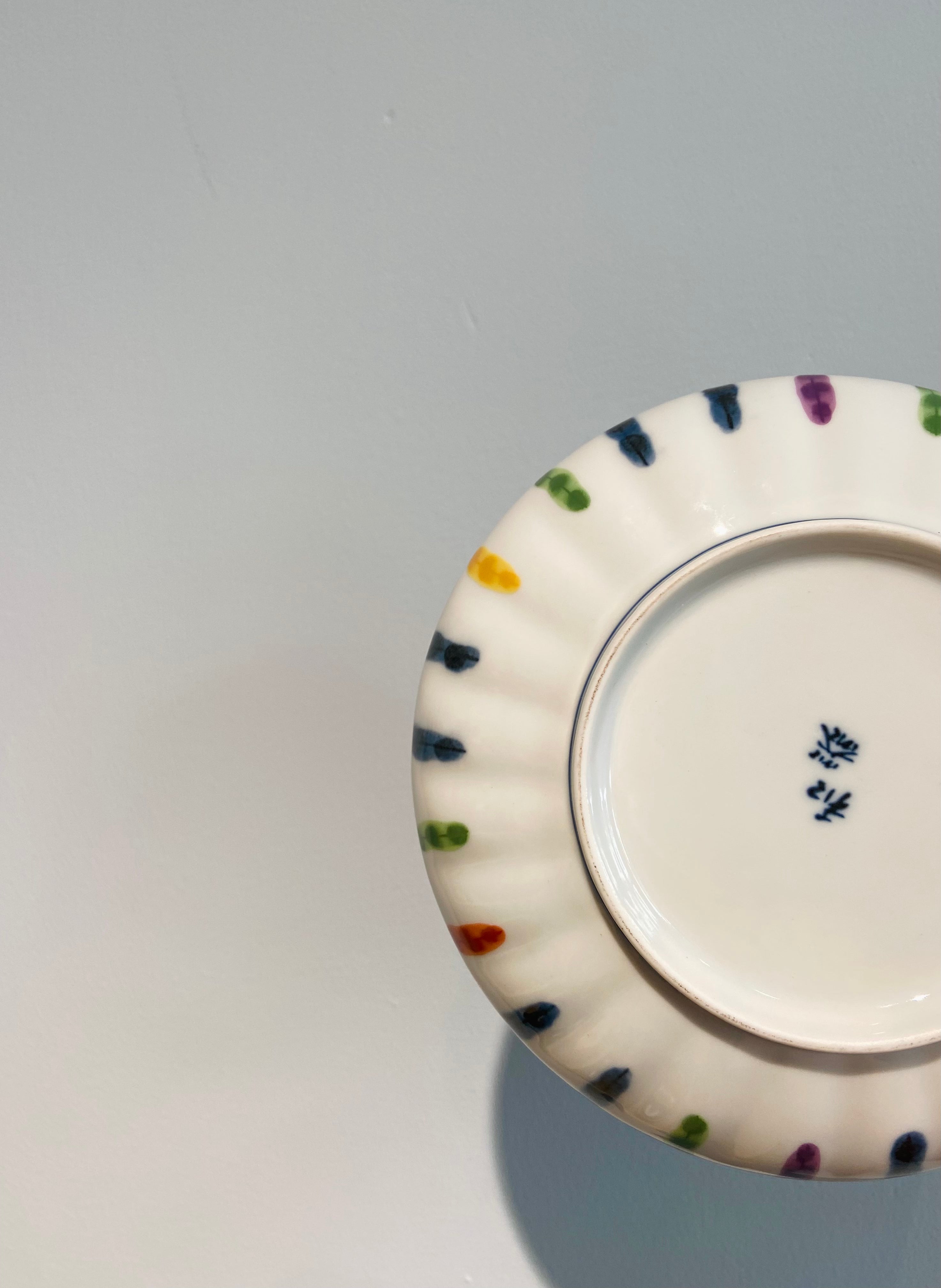 Hand painted plate with multicolored stripes