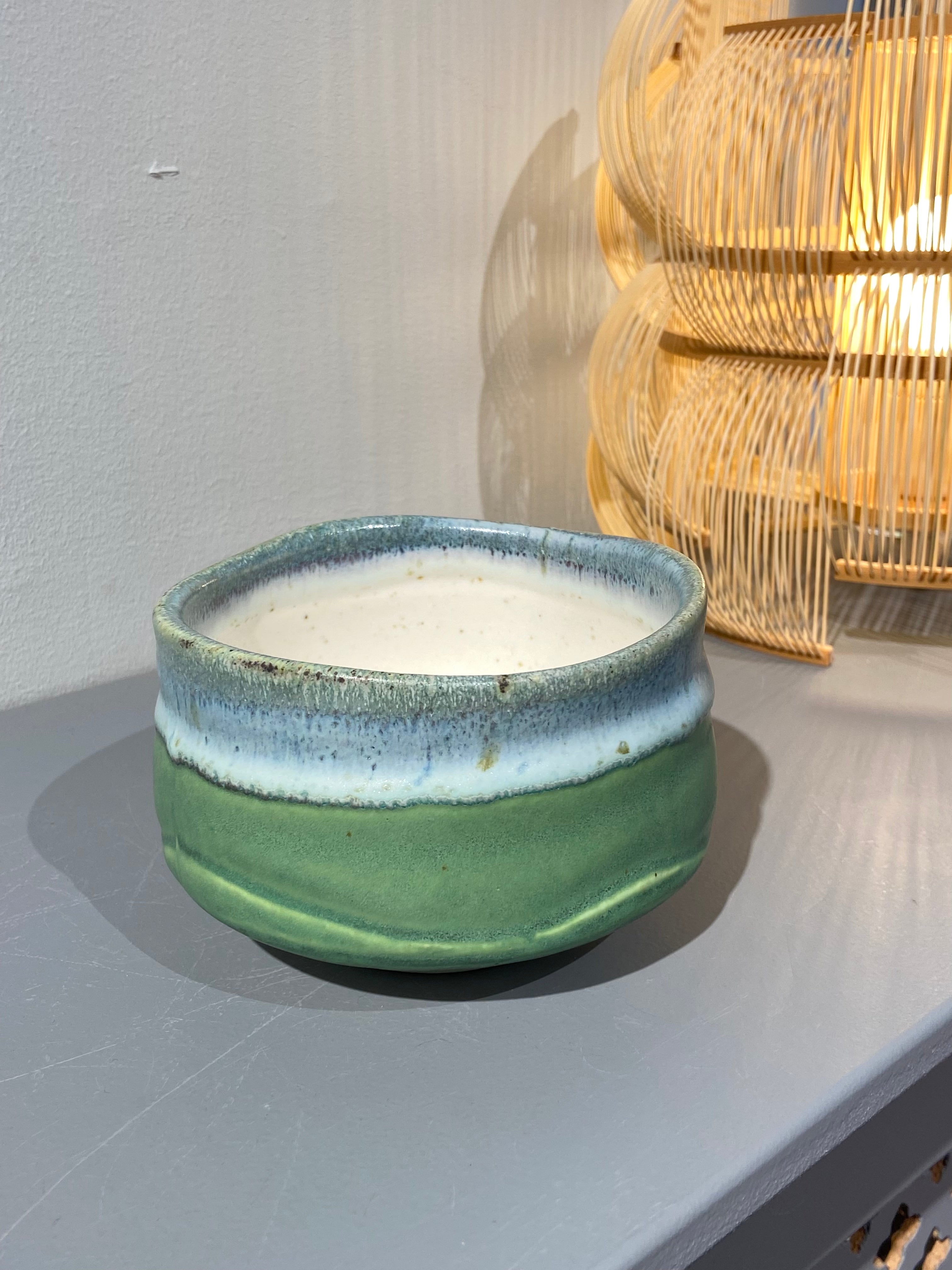 Green matcha cup with blue glaze