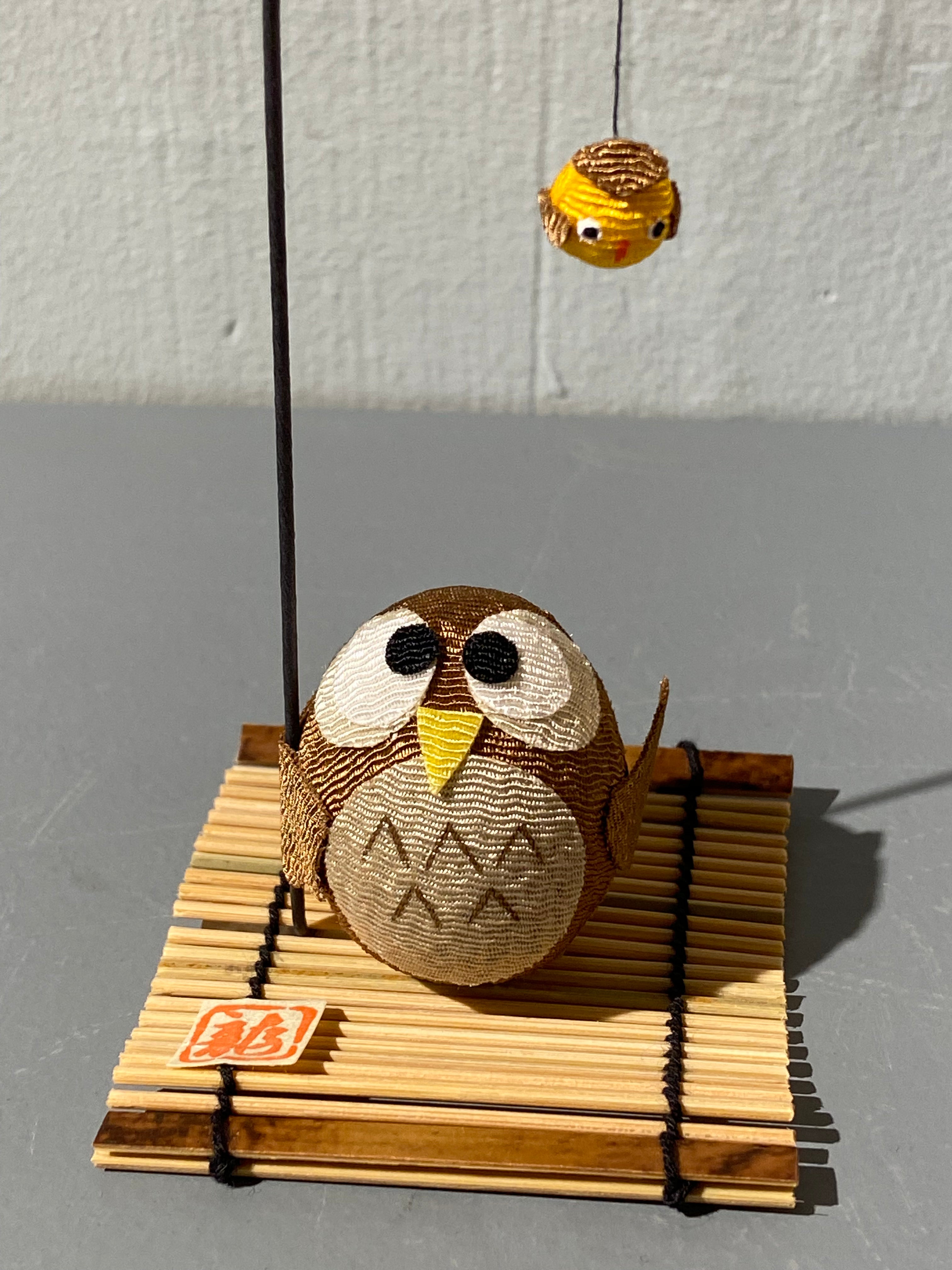 Owl figure with bird