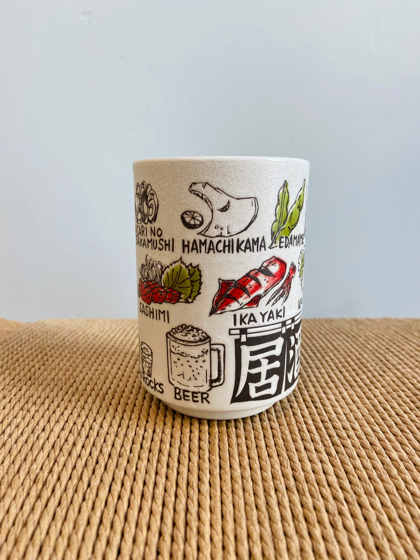 Kop med japanske retter og kok