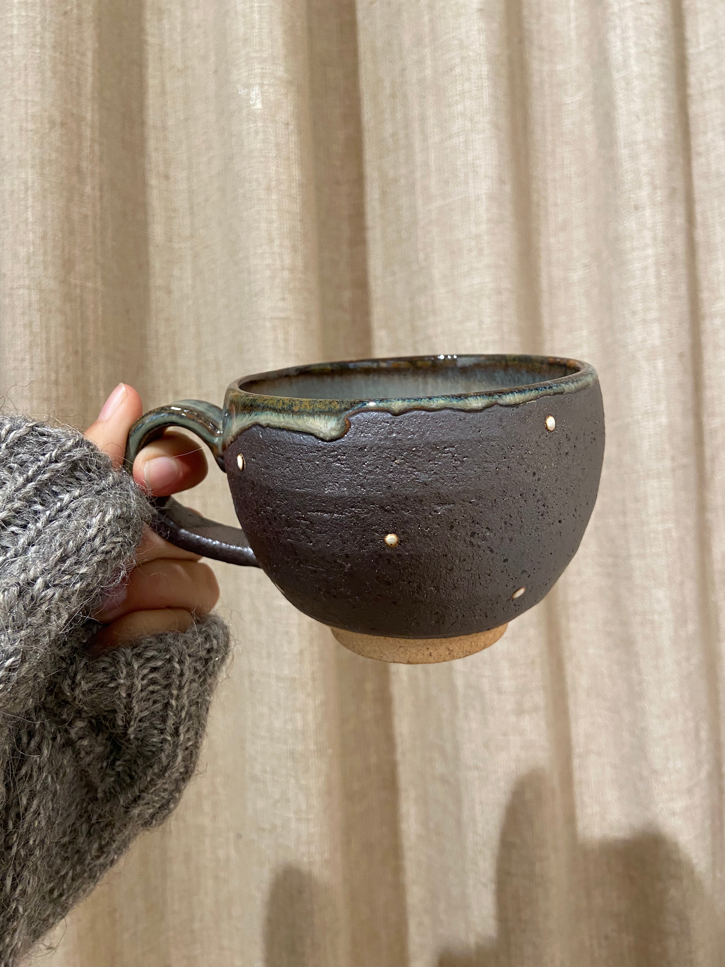Cup with brown glaze and white dots