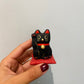 Lucky Cat på pude, sort