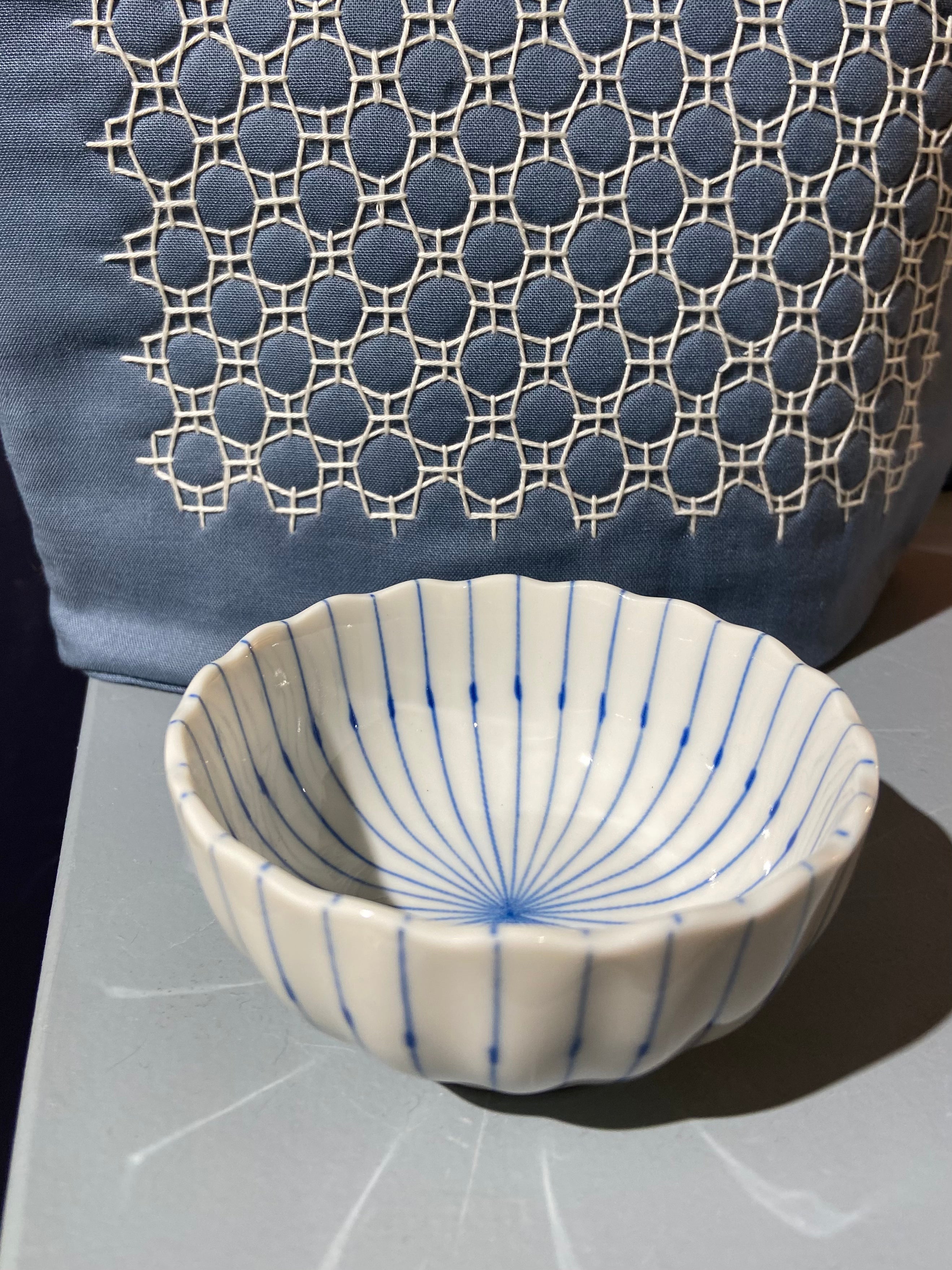 Small white bowl with blue stripes