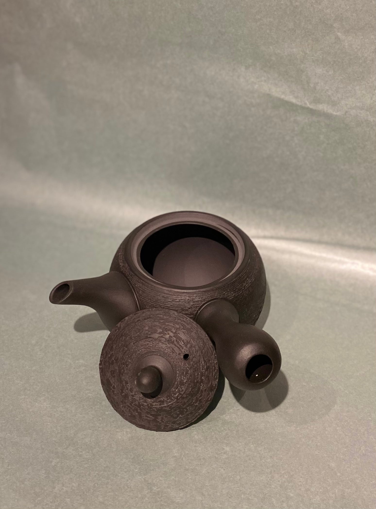 Small rustic dark brown teapot