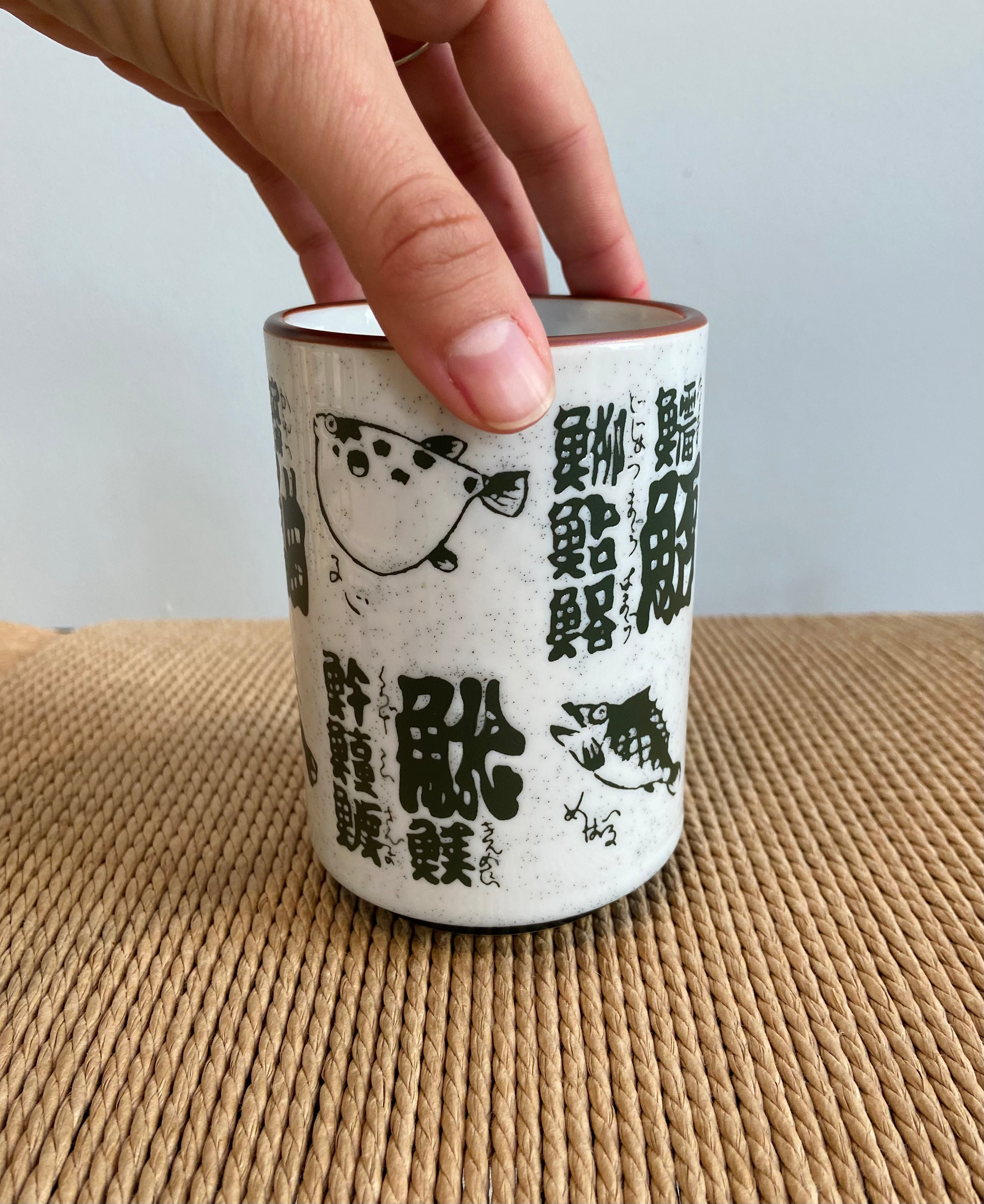 Cup with fish and Japanese motifs