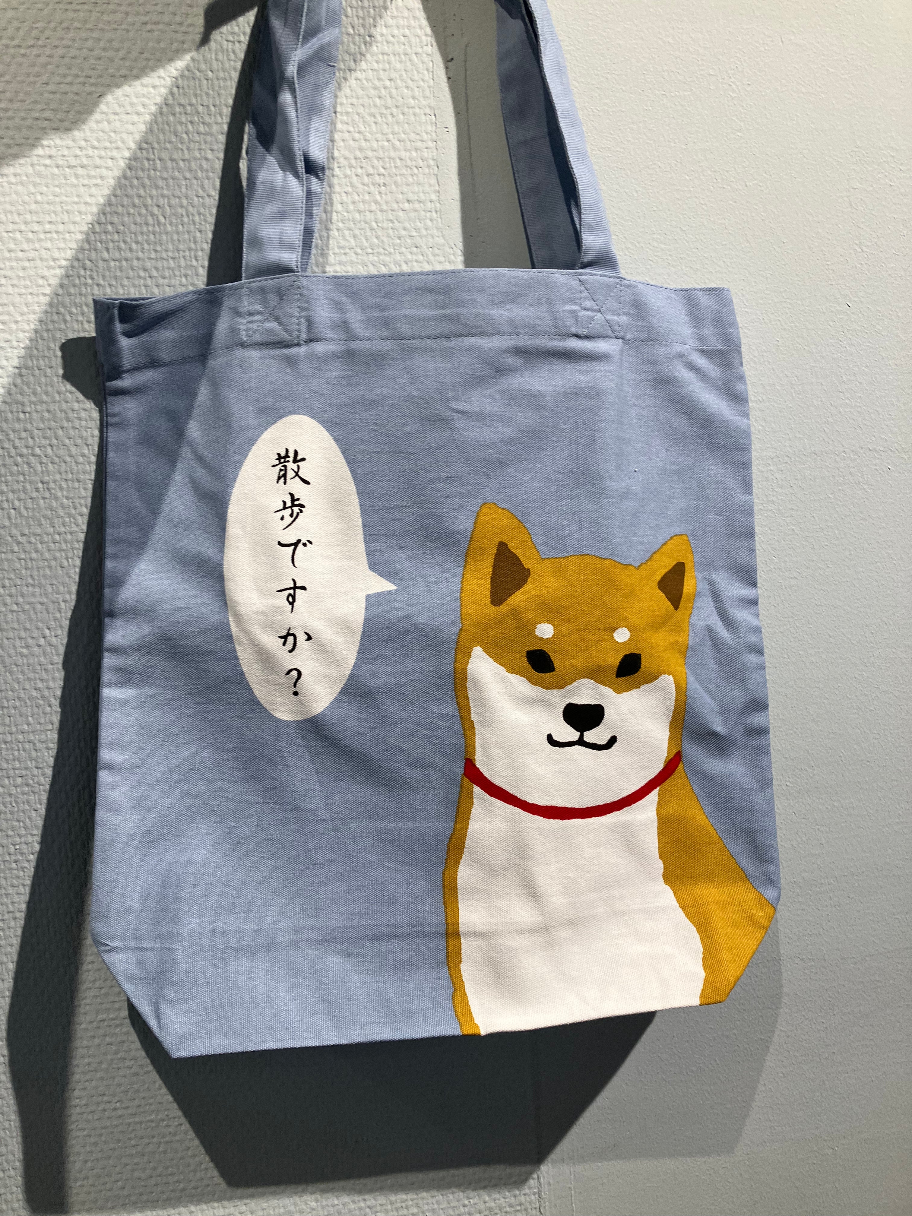 Light blue tote bag: Shiba with speech bubble