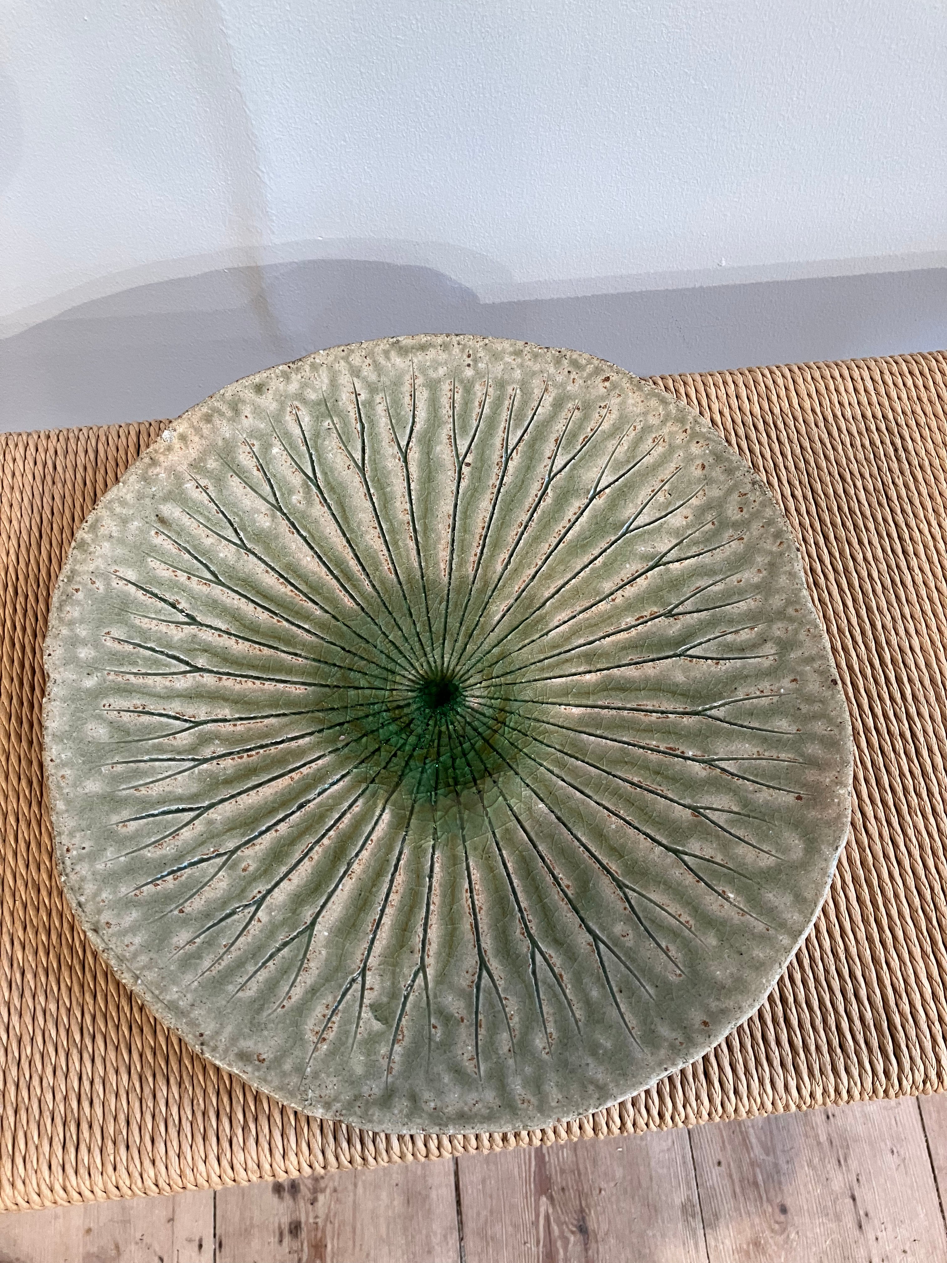 Large round dish with green leaf pattern