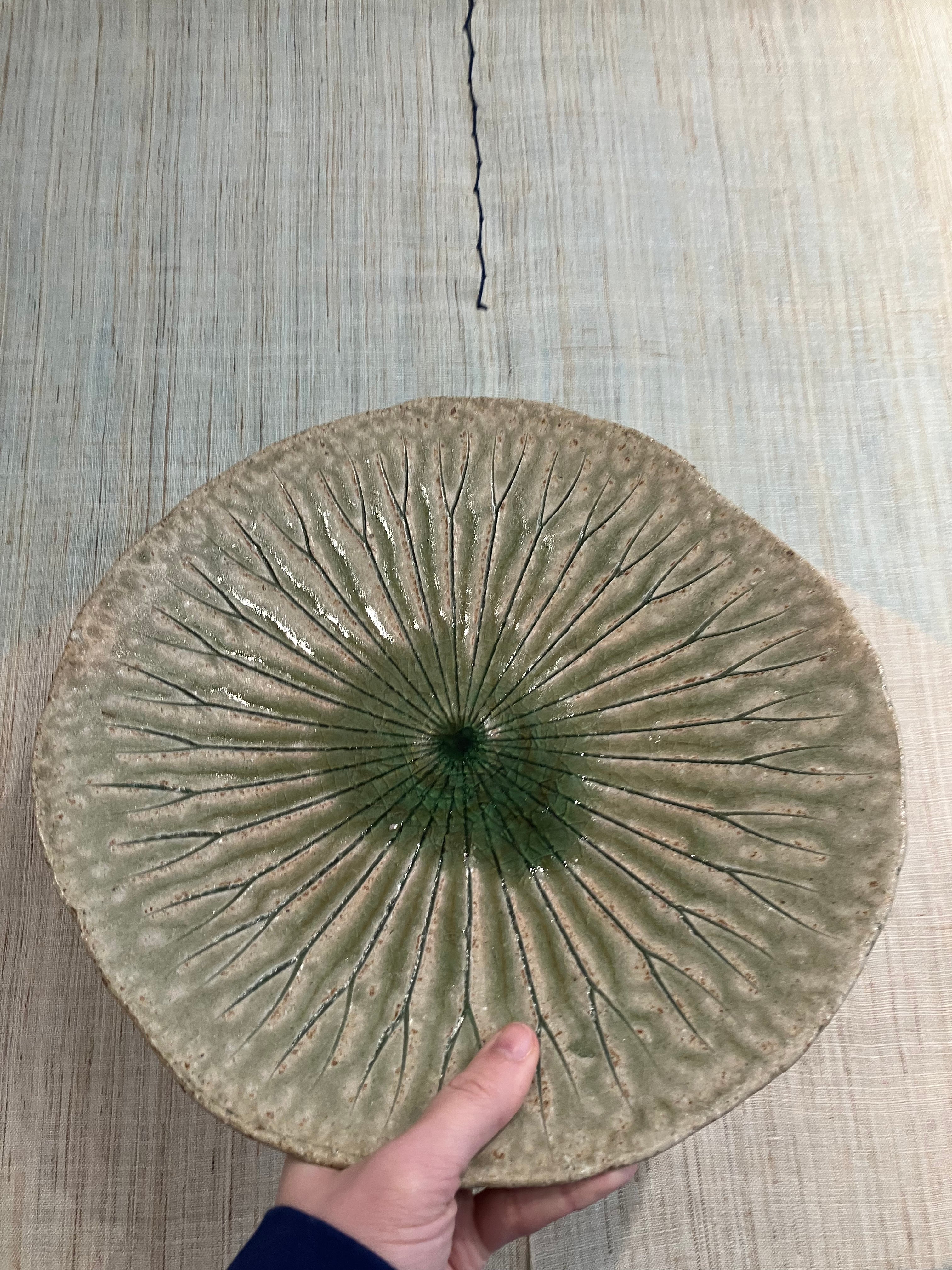 Large round dish with green leaf pattern