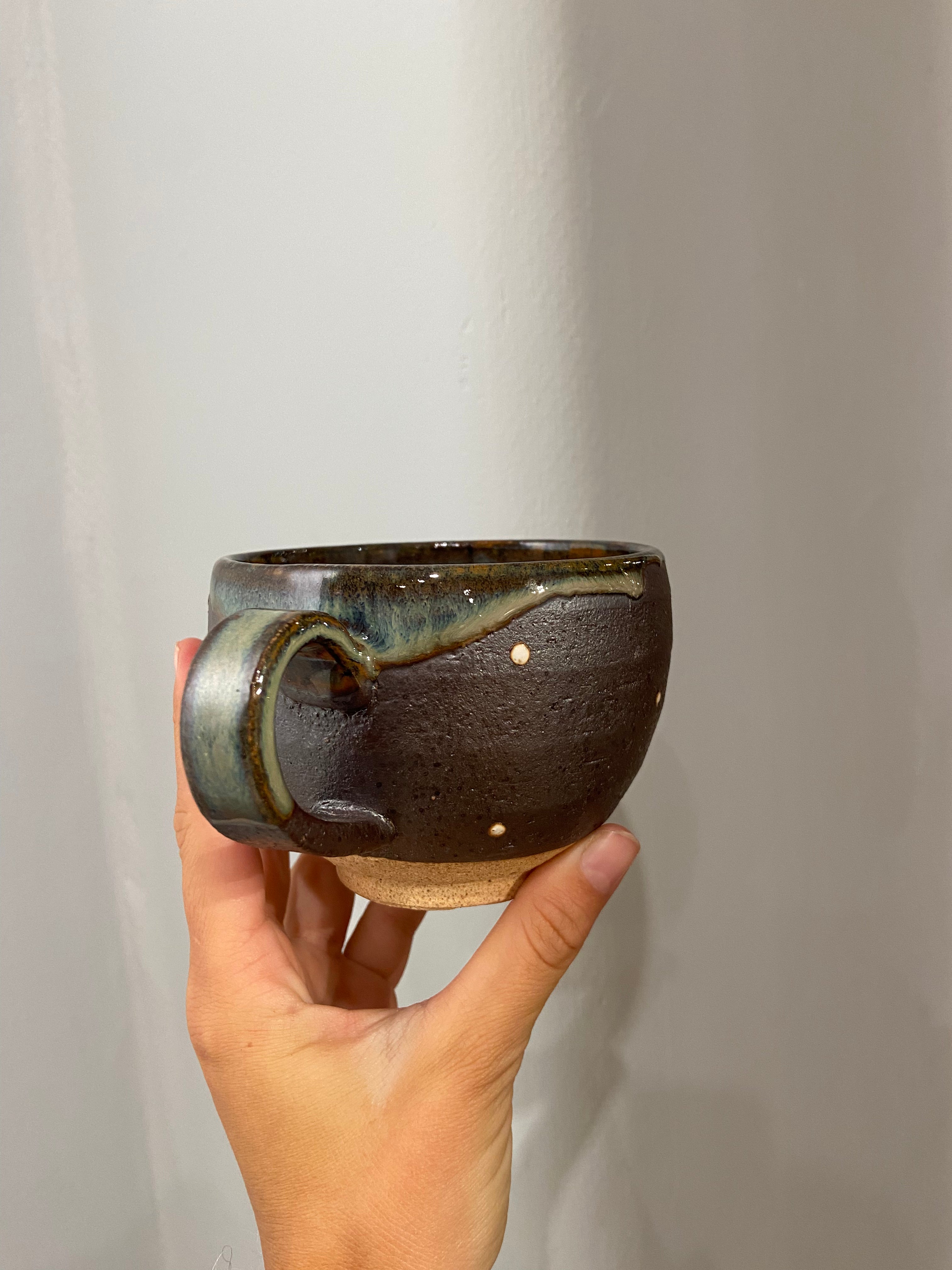 Cup with brown glaze and white dots