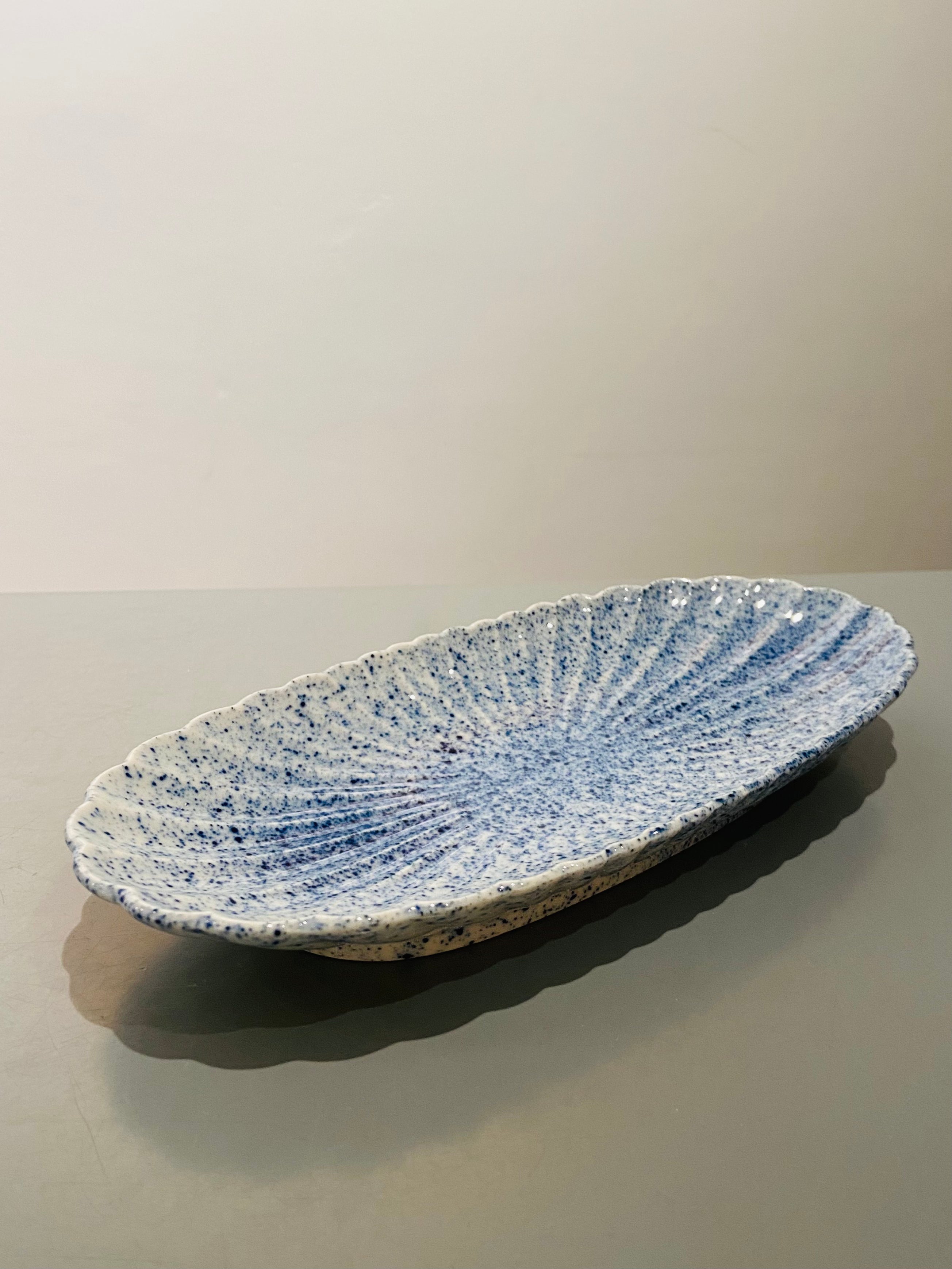 Oval flower dish with blue splash