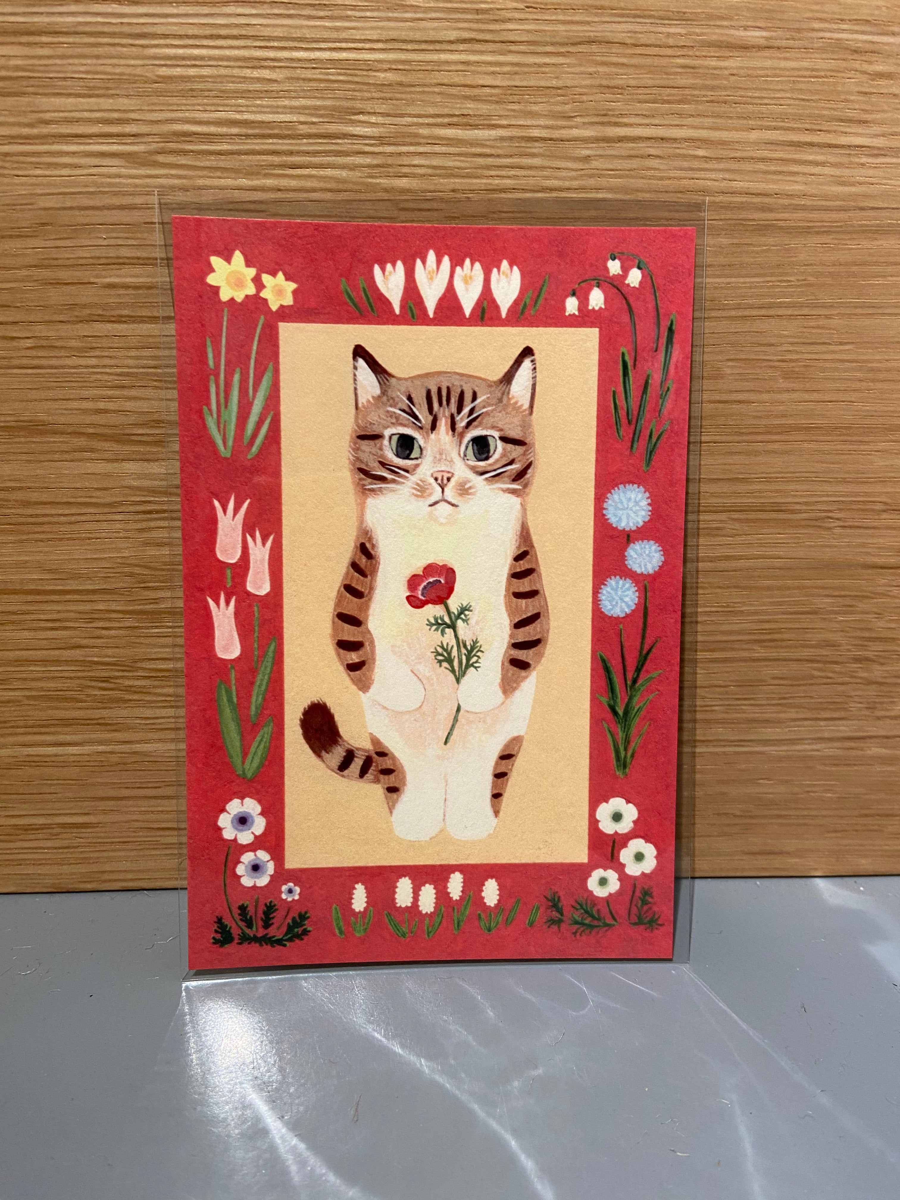 Japanese card with cat with red flower, red