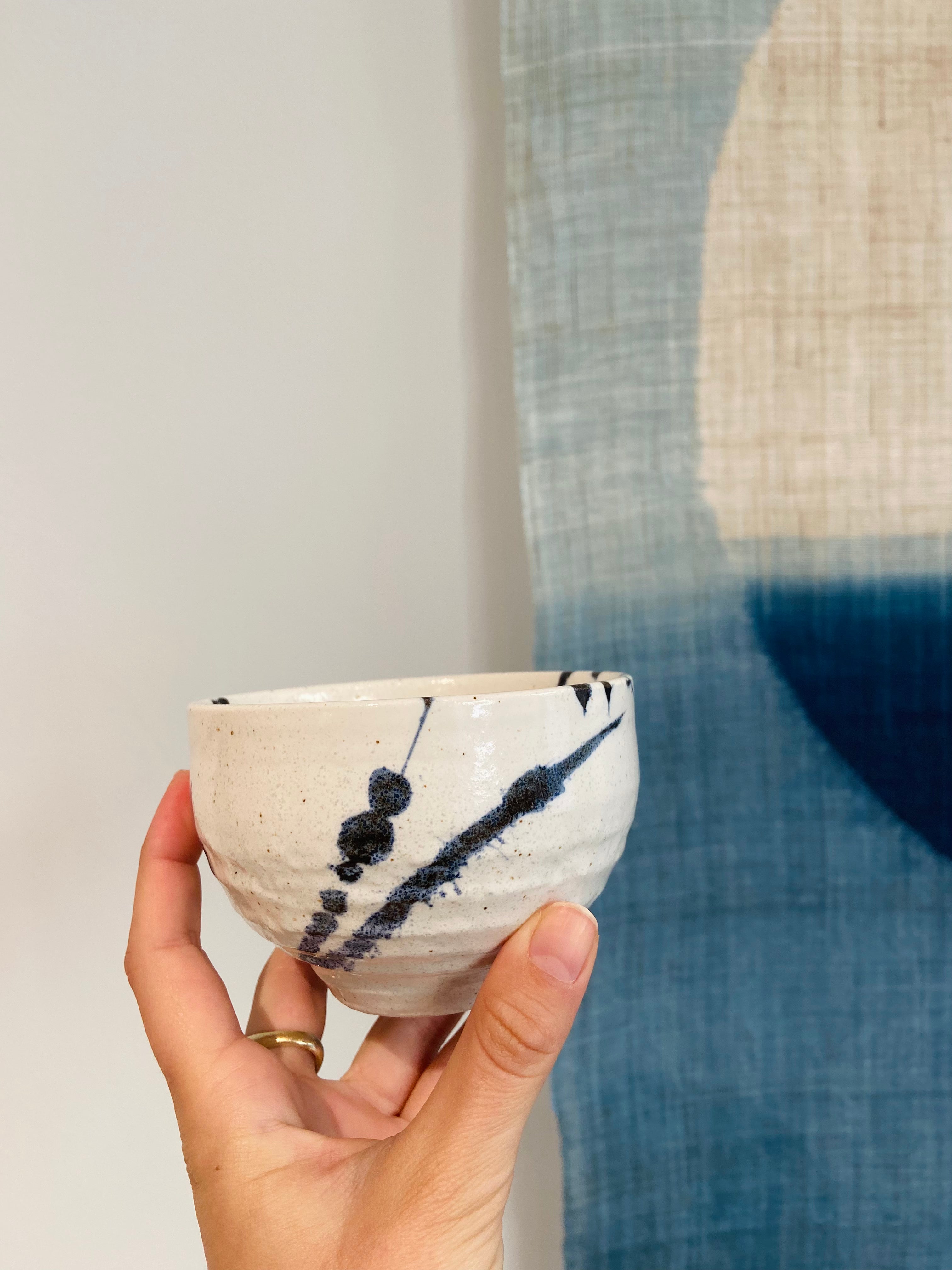 Japanese cup with blue splash pattern