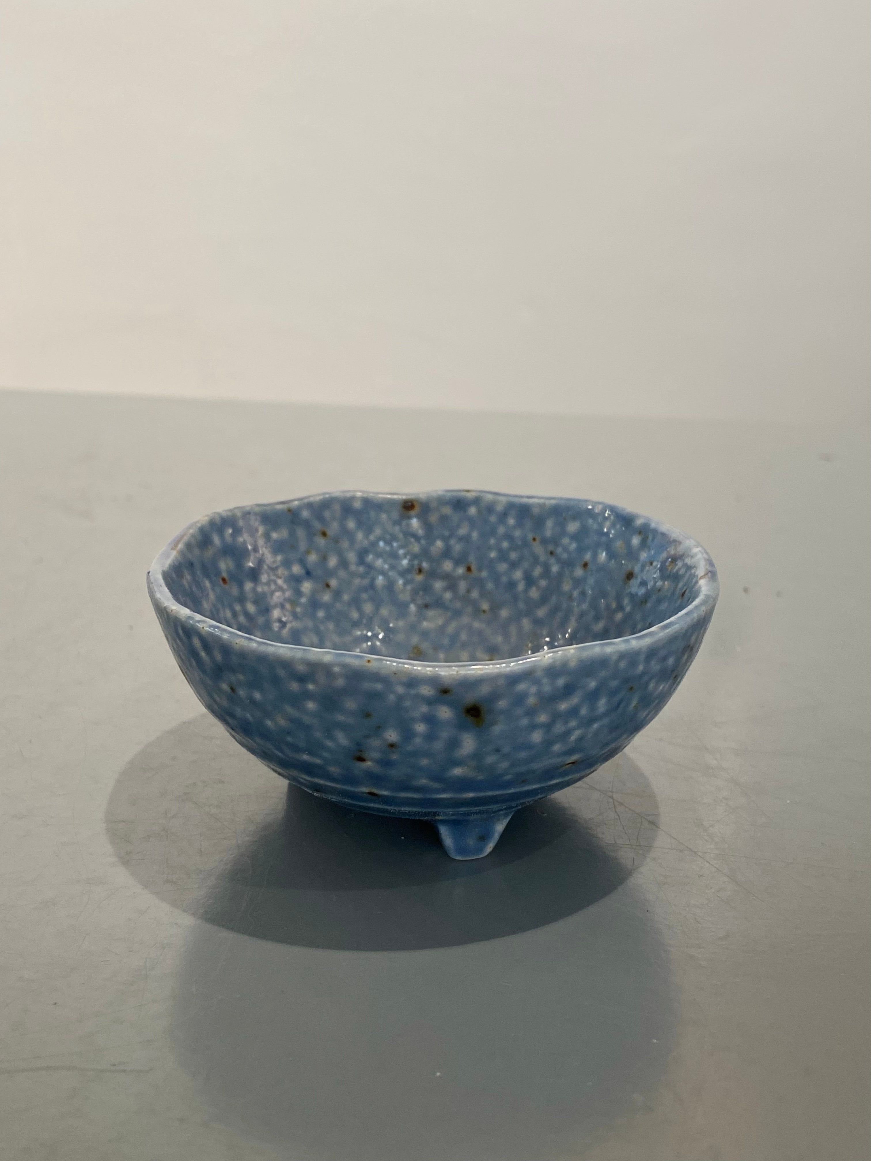 Light blue bowl with three feet