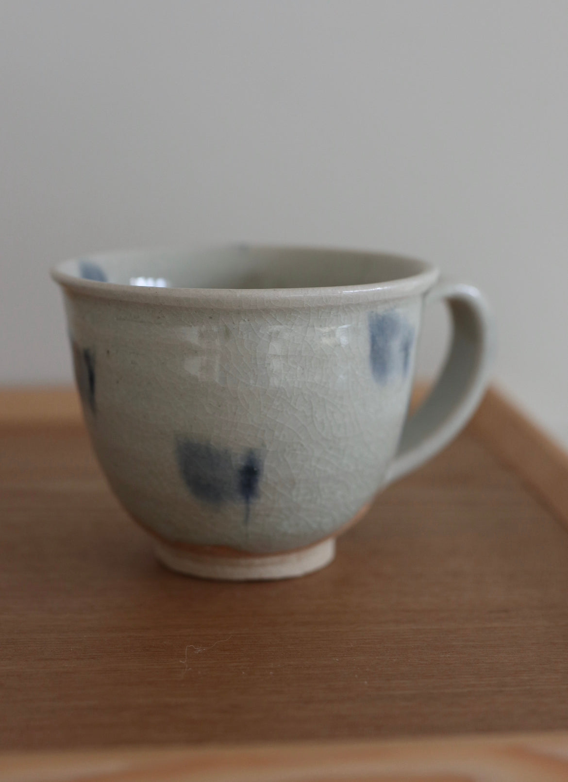 Japanese cup with blue spots and handle