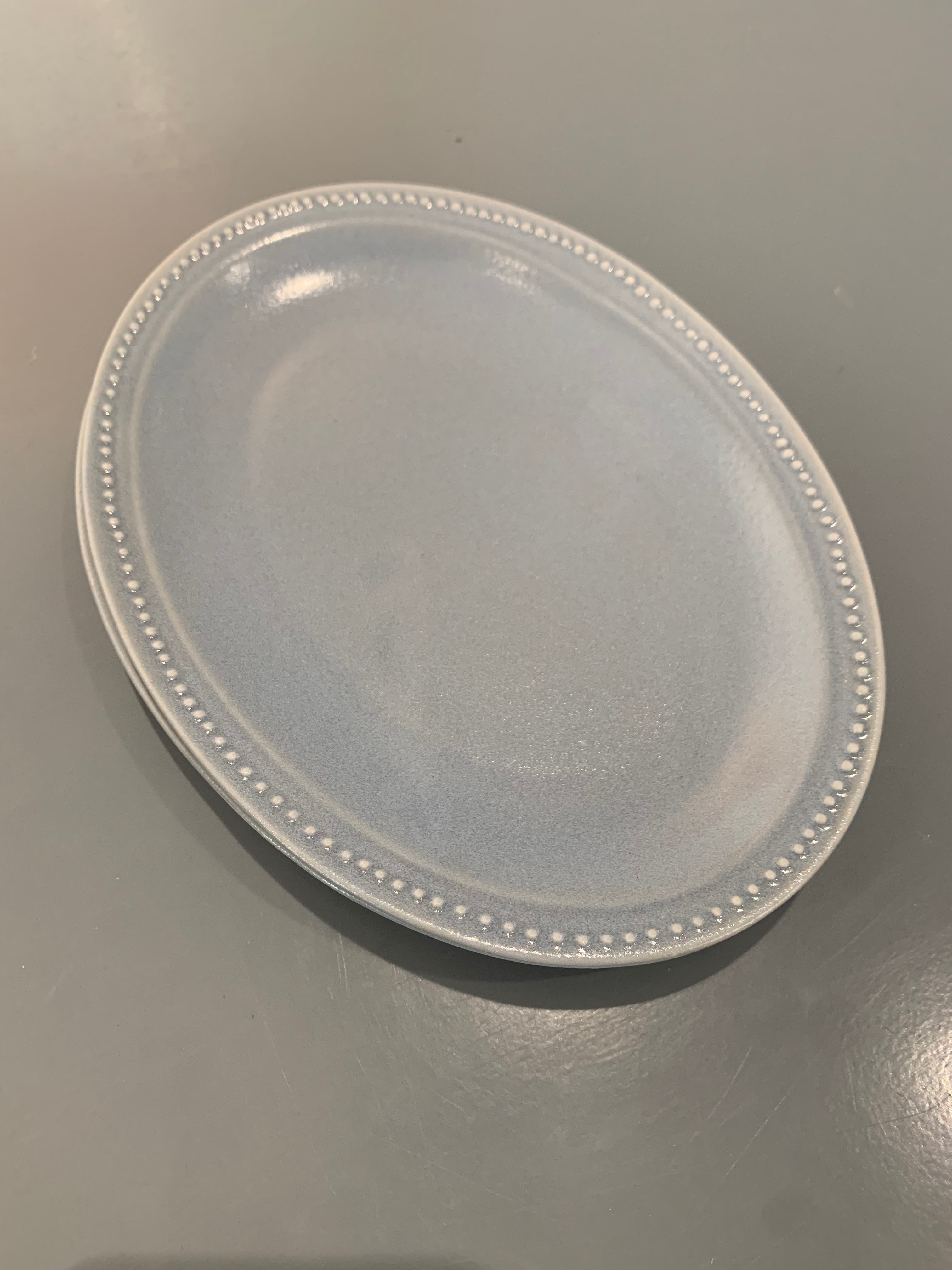 Light blue dish with dots on the edge, small
