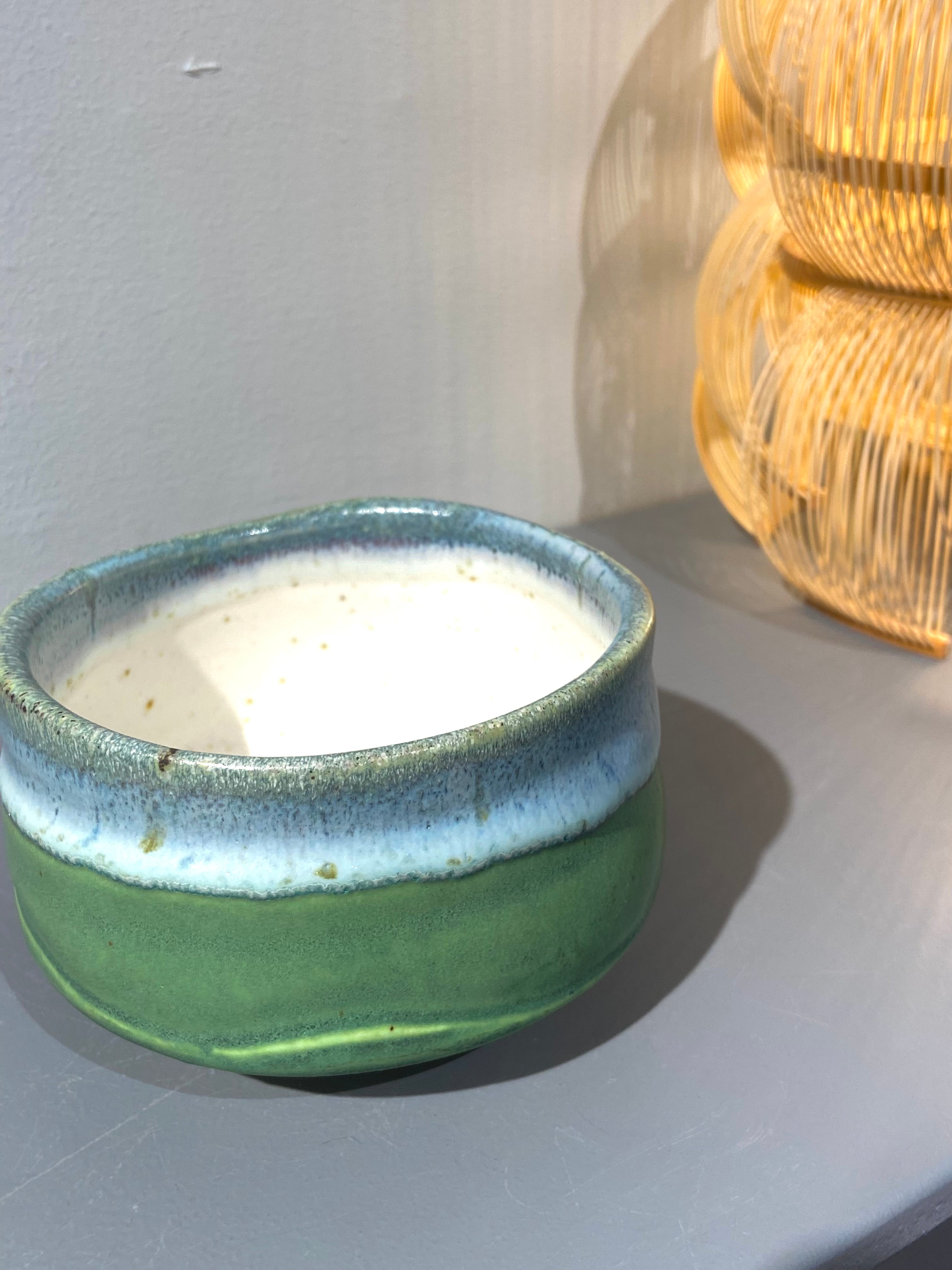 Green matcha cup with blue glaze